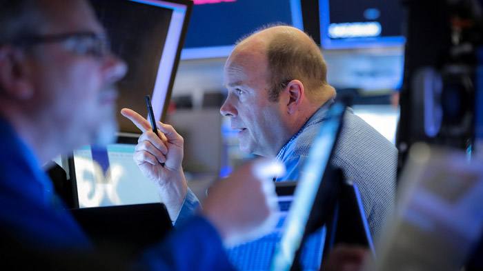 Traders work on the floor at the New York Stock Exchange (NYSE) in New York, U.S., May 3, 2019. REUTERS/Brendan McDermid